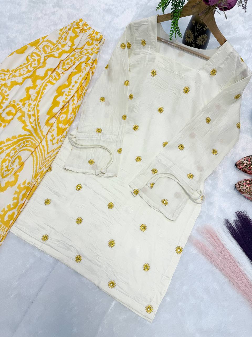 Radiant Ivory White Short Kurti Adorned with Sunshine Yellow Embroidery Paired with a Flowy Patterned Farshi Salwar